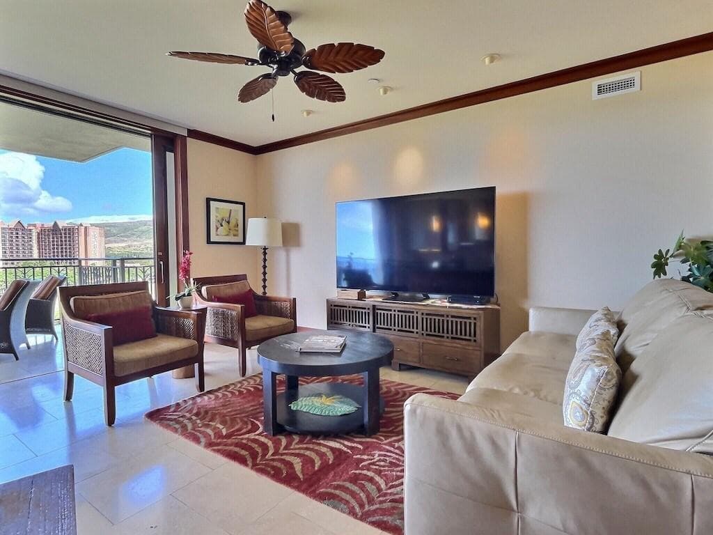 Living room with sofa sleeper and new TV purchased in 2022