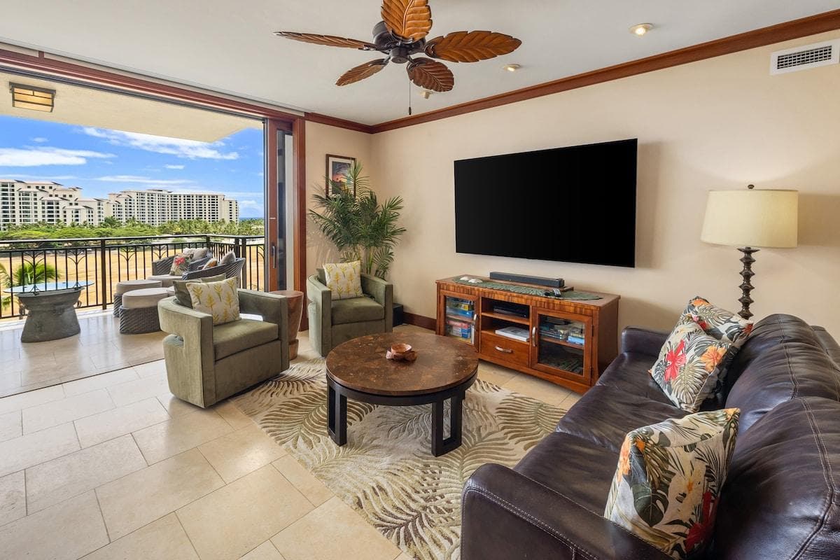 Spacious living room with lanai doors that recess all the way into the walls